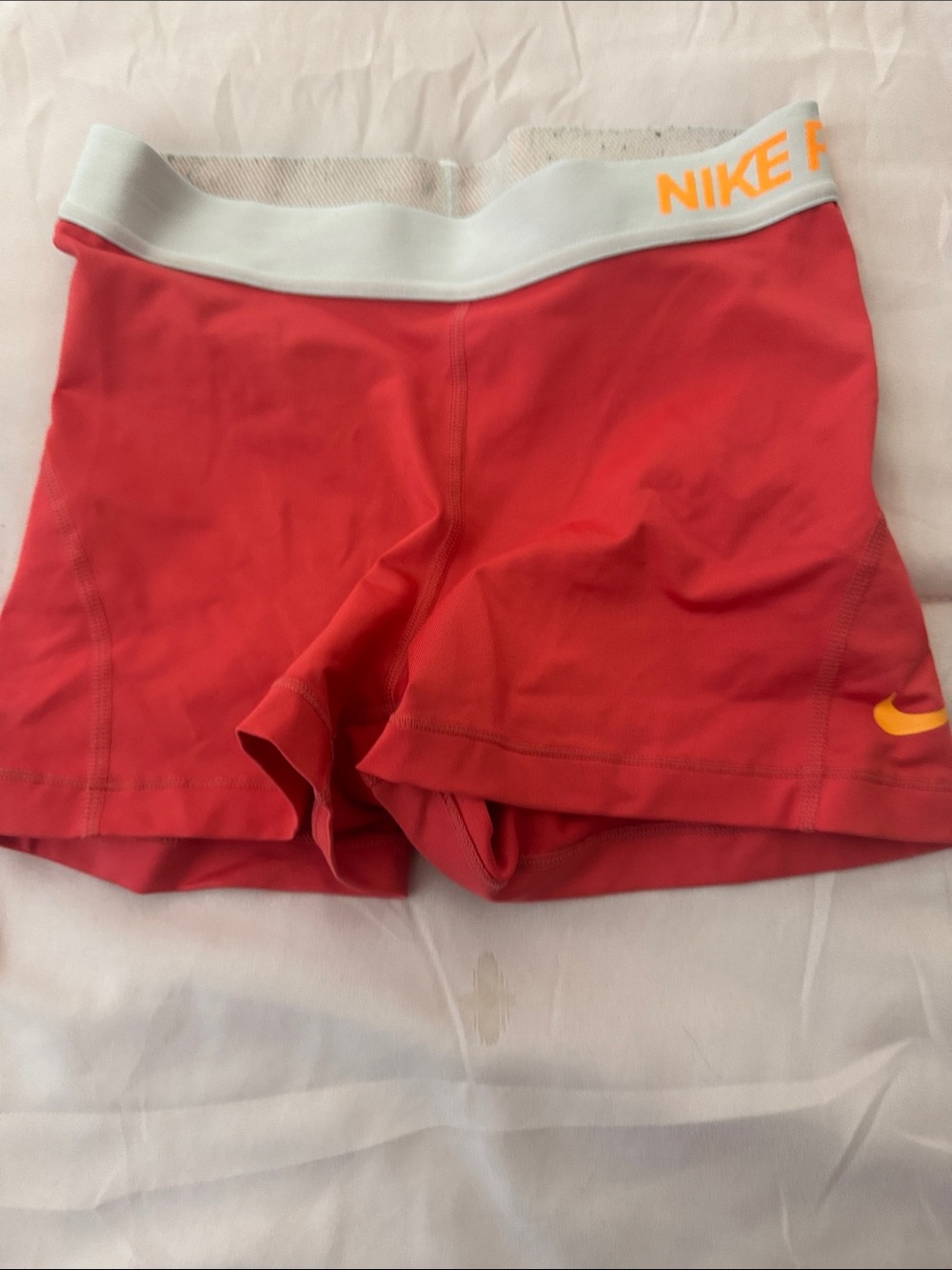 Nike Red Athletic Performance Shorts with White Waistband and Orange Accents